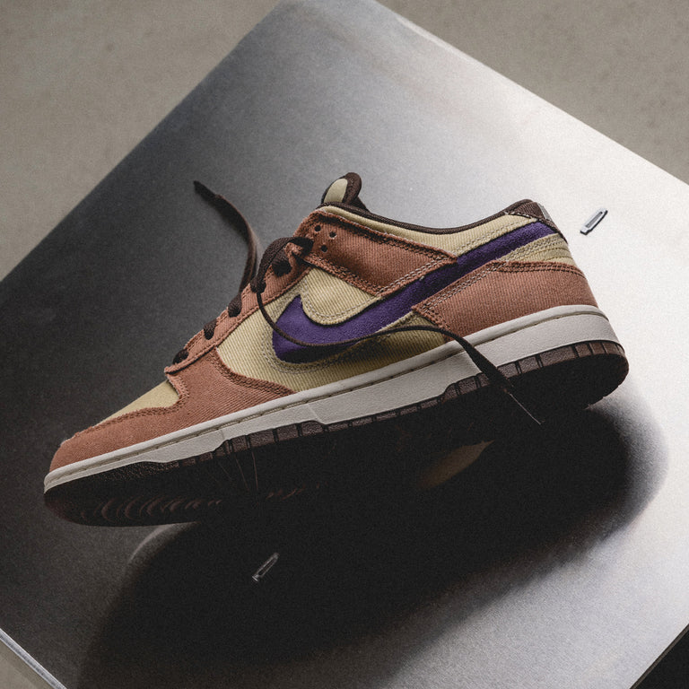 RKyjUHJyHwZzGcKqW1tF_HF3141-200-Nike-Dunk-Low-Retro-SE-Dusted-Clay-Dusty-Amethyst-Team-Gold-sm-1_768x768_crop_center.png