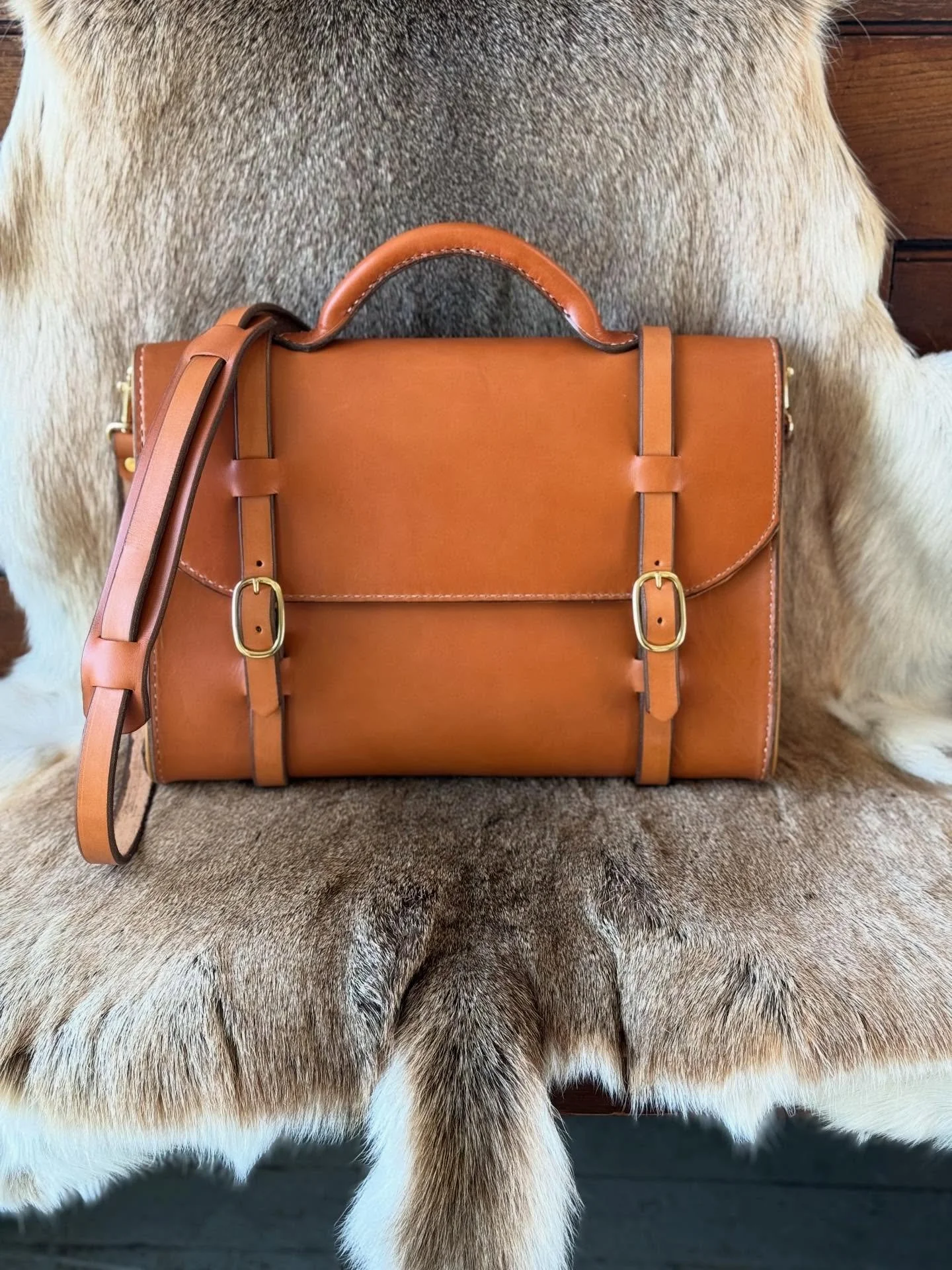 Tan English bridle Victor Powell briefcase. #MAUCLERE #MAUCLERELeather #handstitched #Provincetown #briefcase