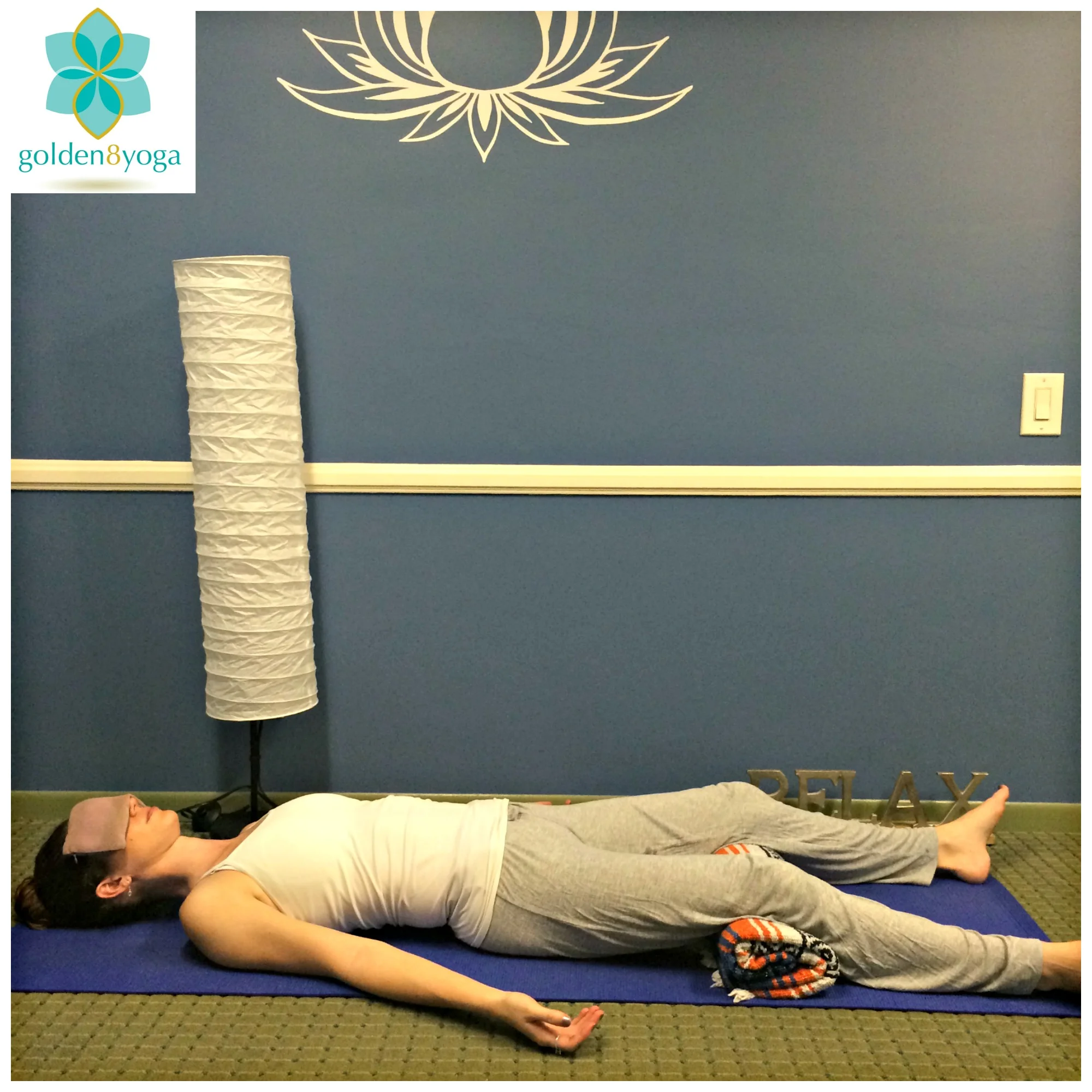 CORPSE POSE & MEDITATION Try this pose to relax your mind and central nervous system. Corpse pose relaxes your body, aids in relieving stress, reduces insomnia, and reduces headache & fatigue. 1. Begin by laying on your back. Feel your pelvis on the ground with a natural and slight arch in your lower back. Feel your legs open up about hip width distance or wider. Allow your legs and feet to naturally roll outwards. 2. Rest your arms along side your body with your palms facing up to encourage your shoulders and chest to open. Feel the back of your neck lengthen. 3. I like to add a rolled up blanket under my knees to add extra comfort and to help any possible low back discomfort. I also love using an eye pillow to help deepen the relaxation. 4. Stay in Corpse pose from 5-20 minutes and while you are here begin to focus on your breath. Begin to notice the rise and fall of every inhale and exhale. Notice if you are able to take a full breath in and out or if you notice shortness or shallowness at any part of your breath. Notice the pauses in between each inhale and exhale. Feel the air entering through your notice and filling up your body, and notice the warm air as it exits out through your nose. Feel yourself becoming more and more relaxed with every exhale. 5. To come out of the pose begin draw awareness back to your body by wiggling your fingers and toes and rolling out your wrists and ankles. You can gently hug your knees into your chest and rock side to side. When you are ready roll over to your right side and gently press yourself up to seated.