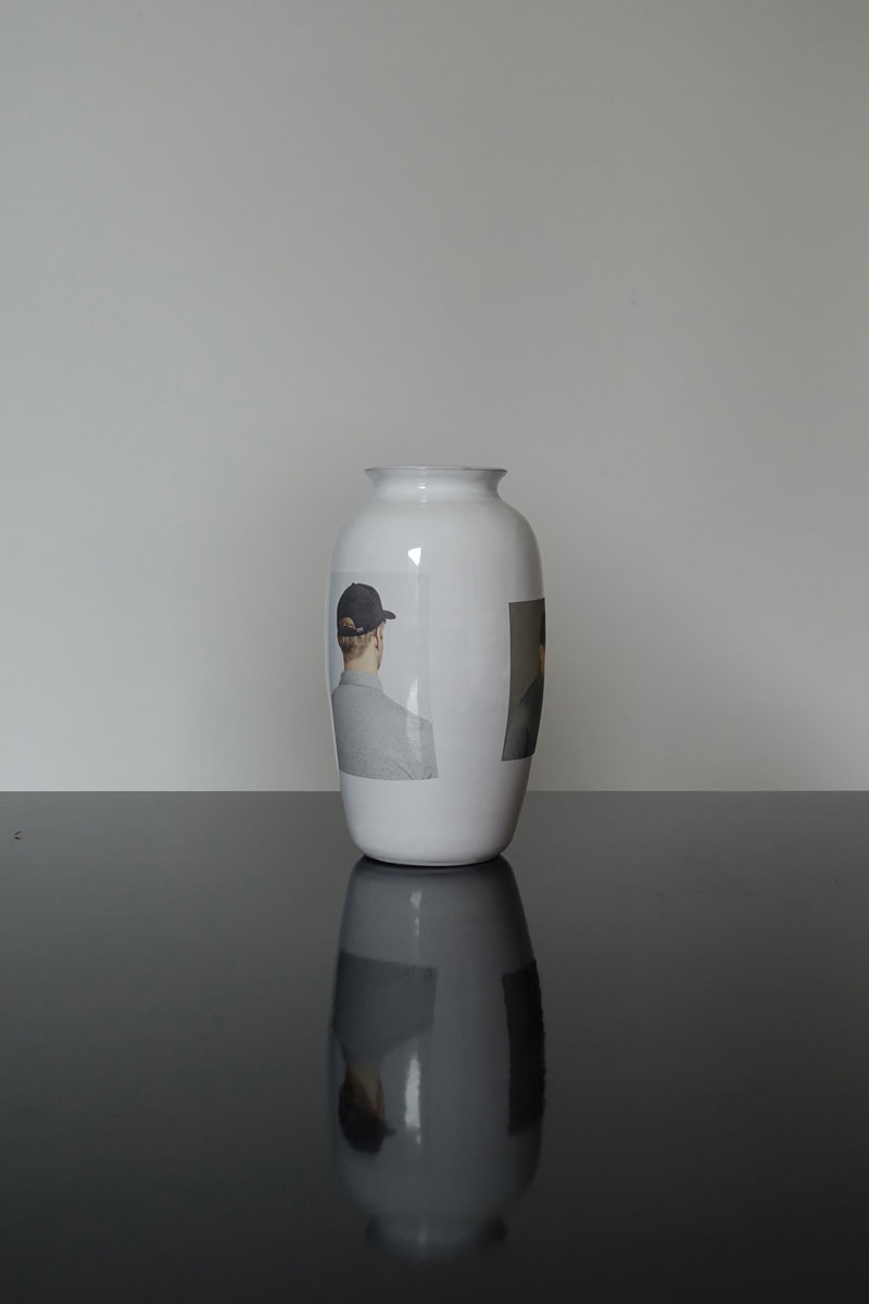   ORDER   Order is a collection of white glazed ceramic vases on which are applied digitally printed ceramic transfers of portraits of boys wearing a cap. The images are found and collected on online shops. 