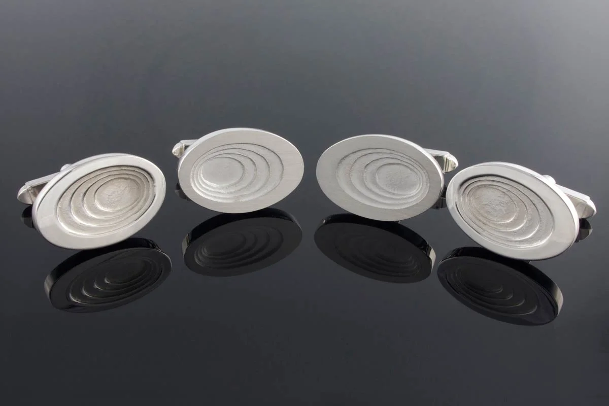 Graduated oval sterling silver cufflinks