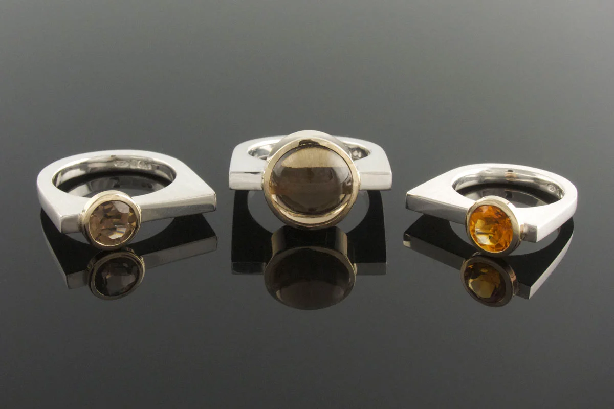 Silver U shaped rings with 9ct yellow gold bezel
