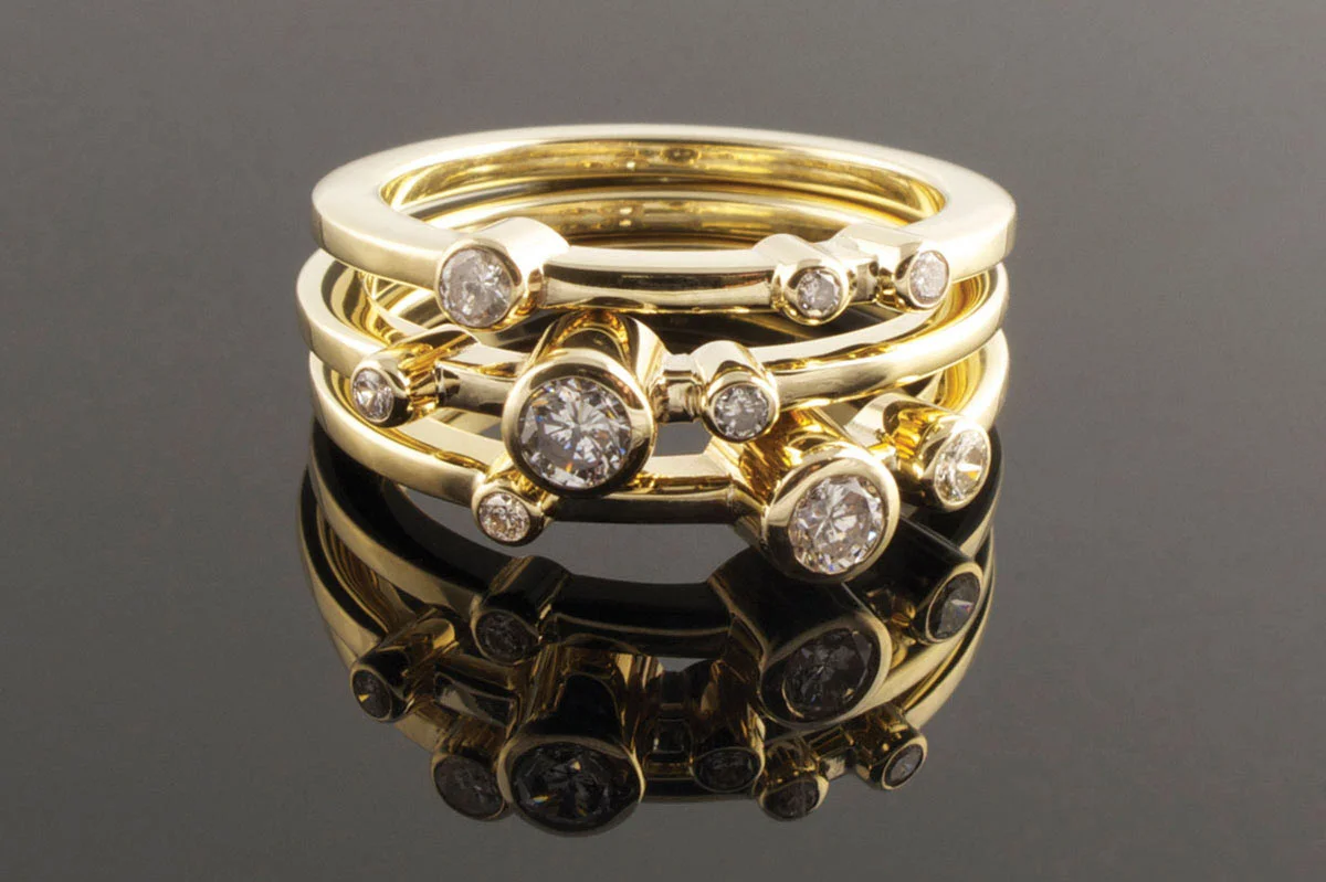 Three yellow gold and diamond rings
