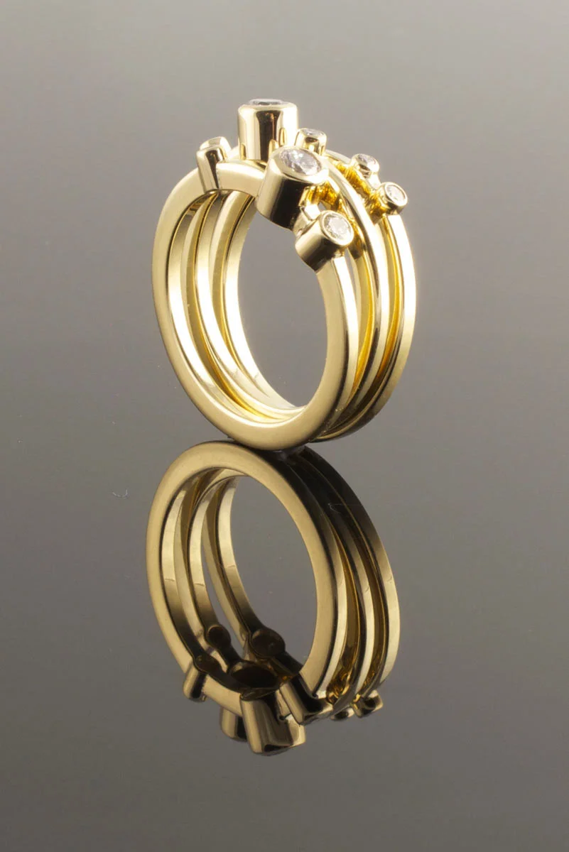 Three yellow gold and diamond rings