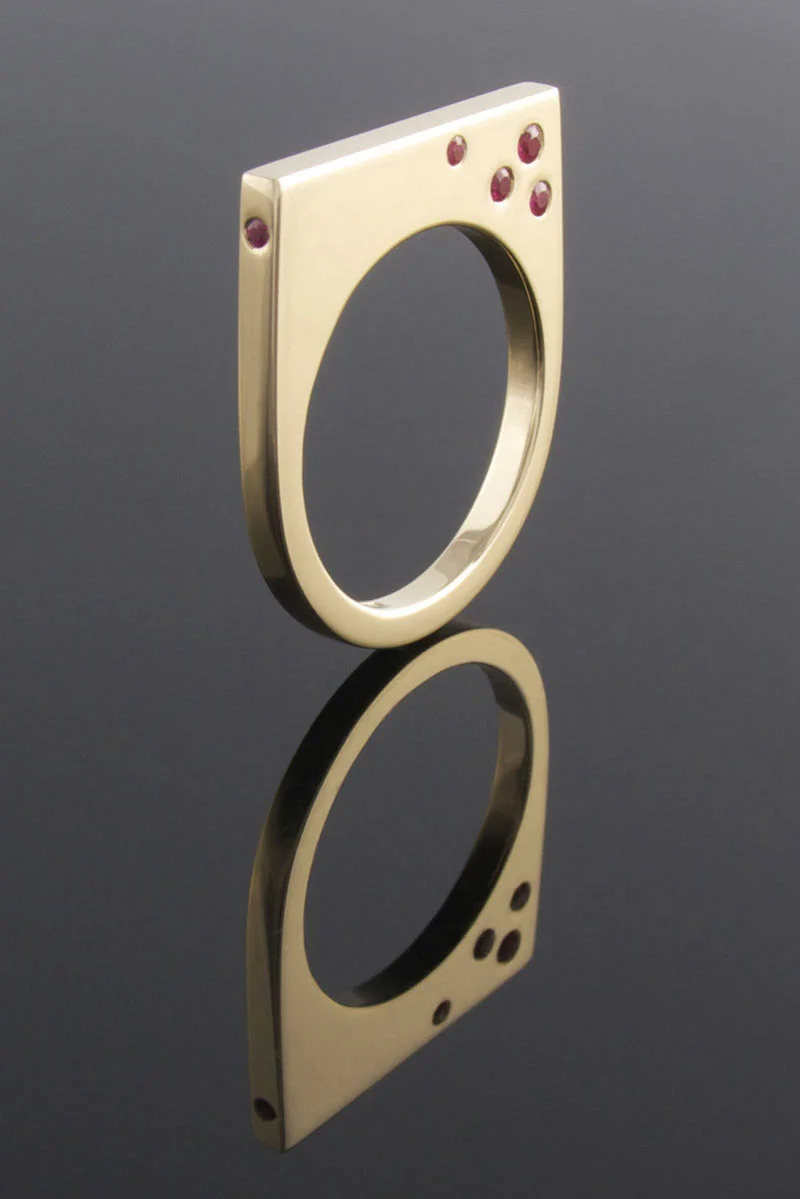 Punch set ruby and 9ct yellow gold U-shaped ring