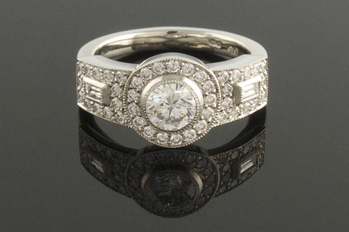 Platinum three stone cluster engagement ring