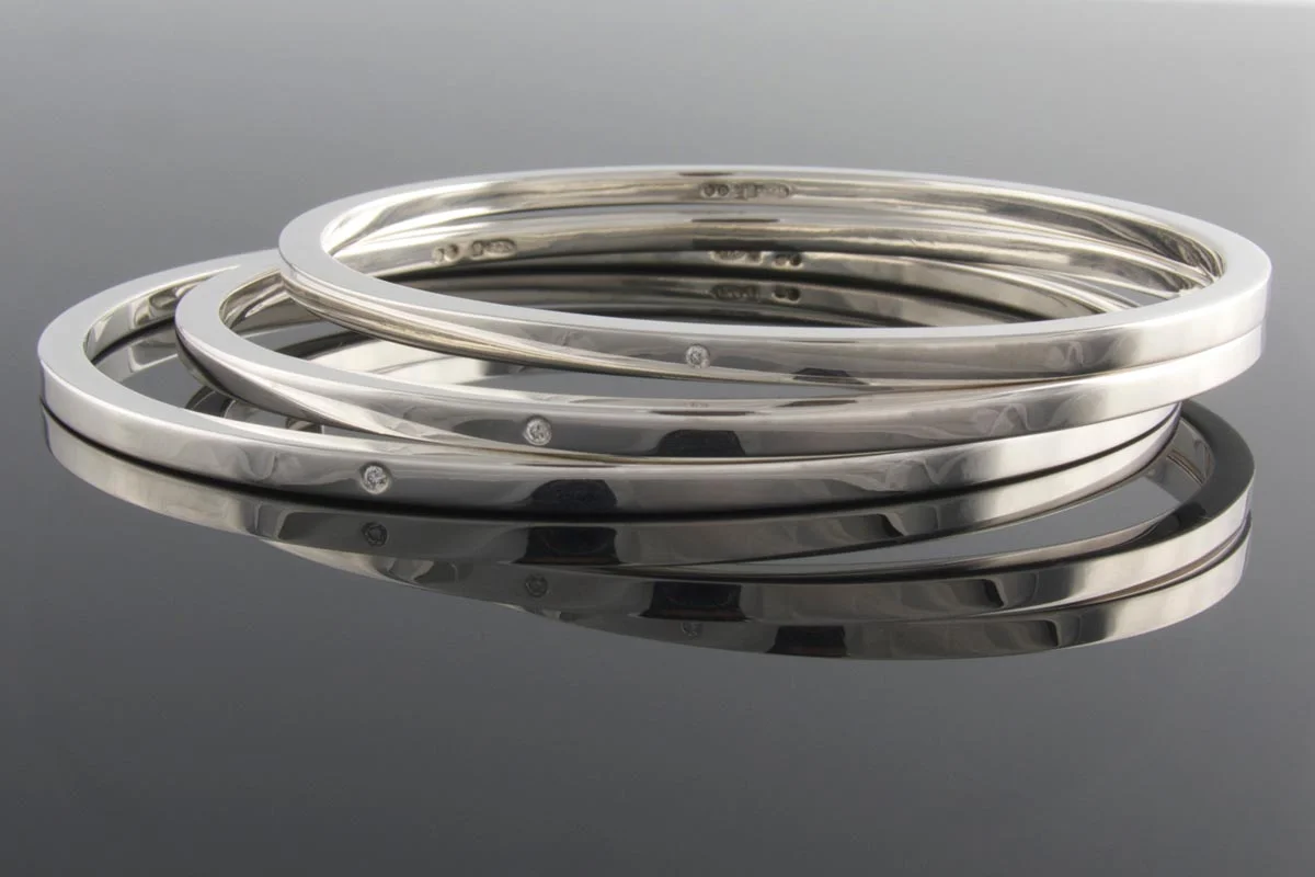 Sterling silver bangles with punch set diamond