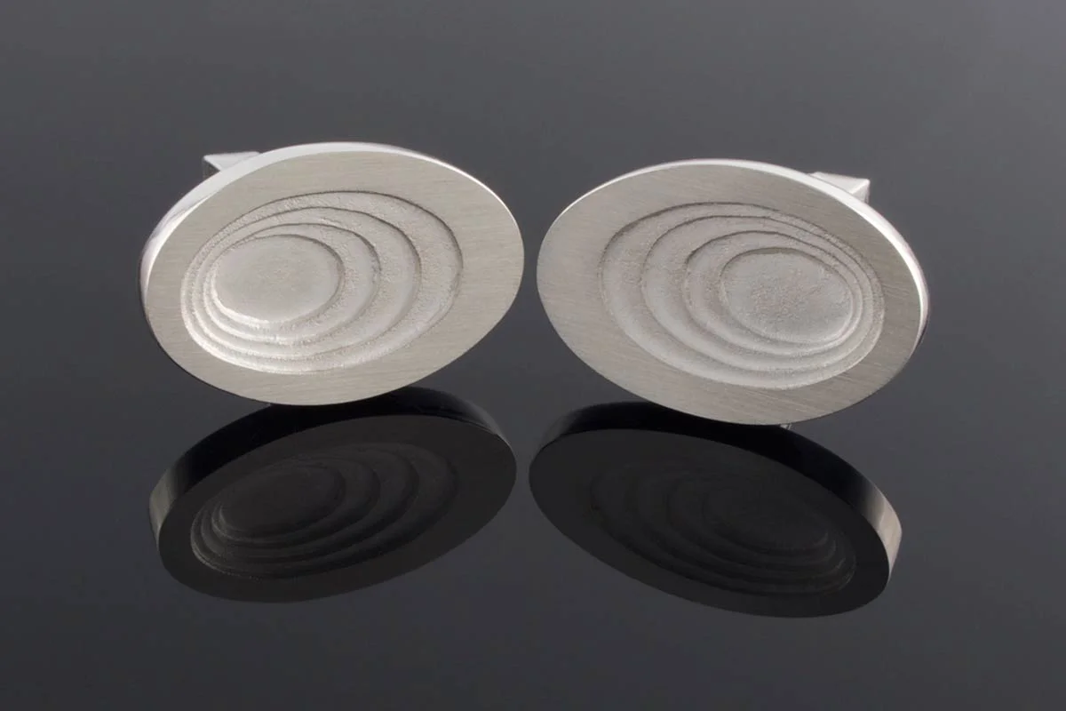 Graduated oval silver cufflinks