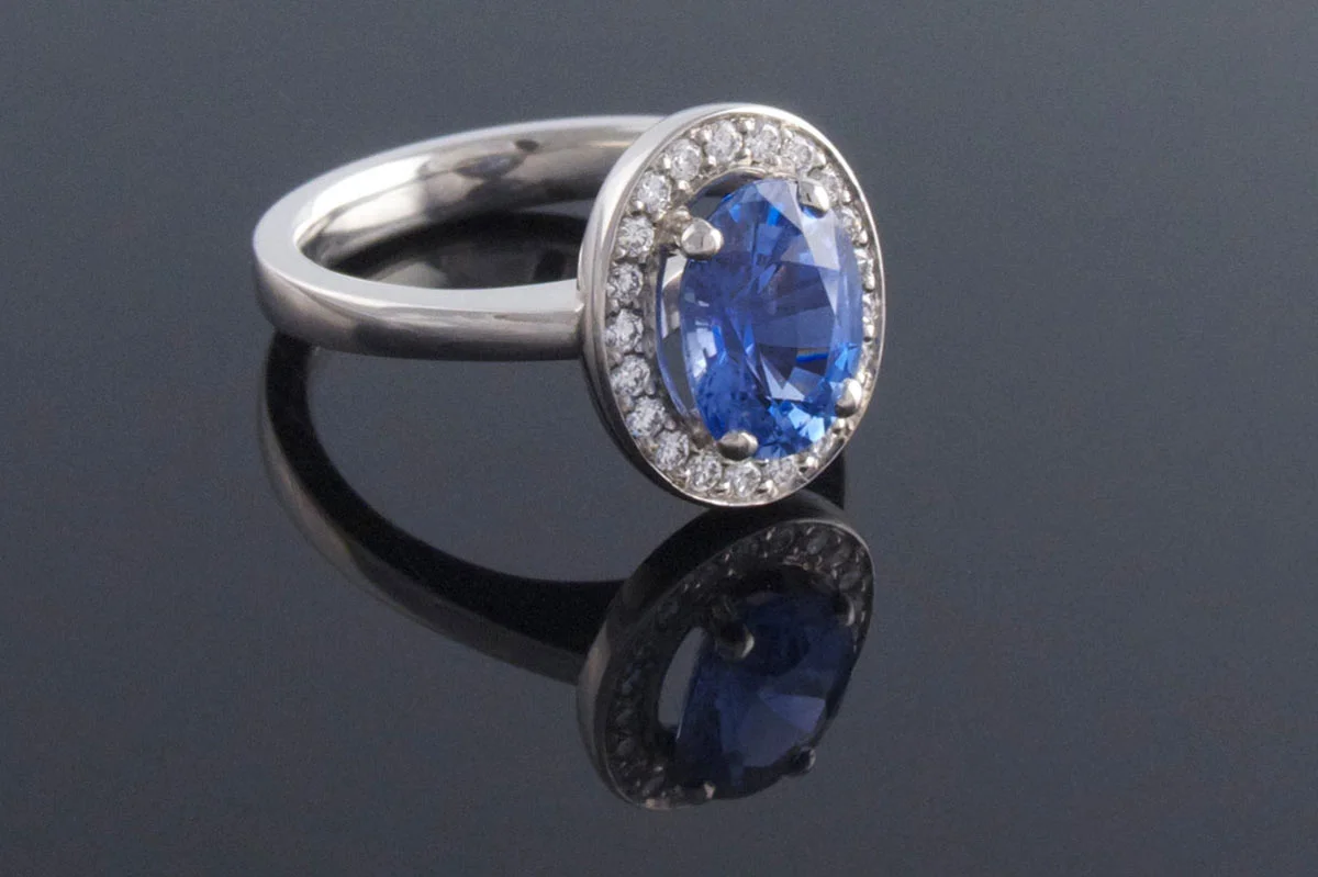 Bespoke 4 claw sapphire cluster engagement ring