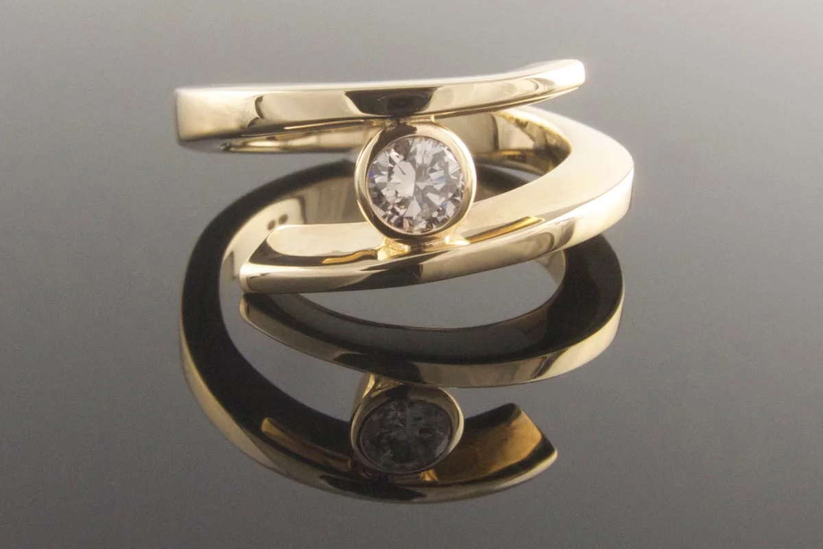 Twisted diamond solitaire ring
