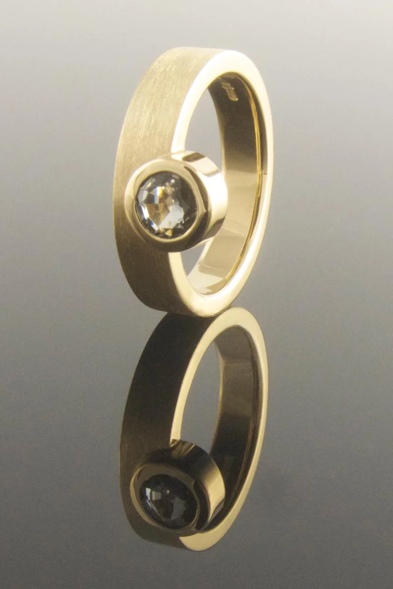 Contemporary asymmetrical sapphire engagement ring