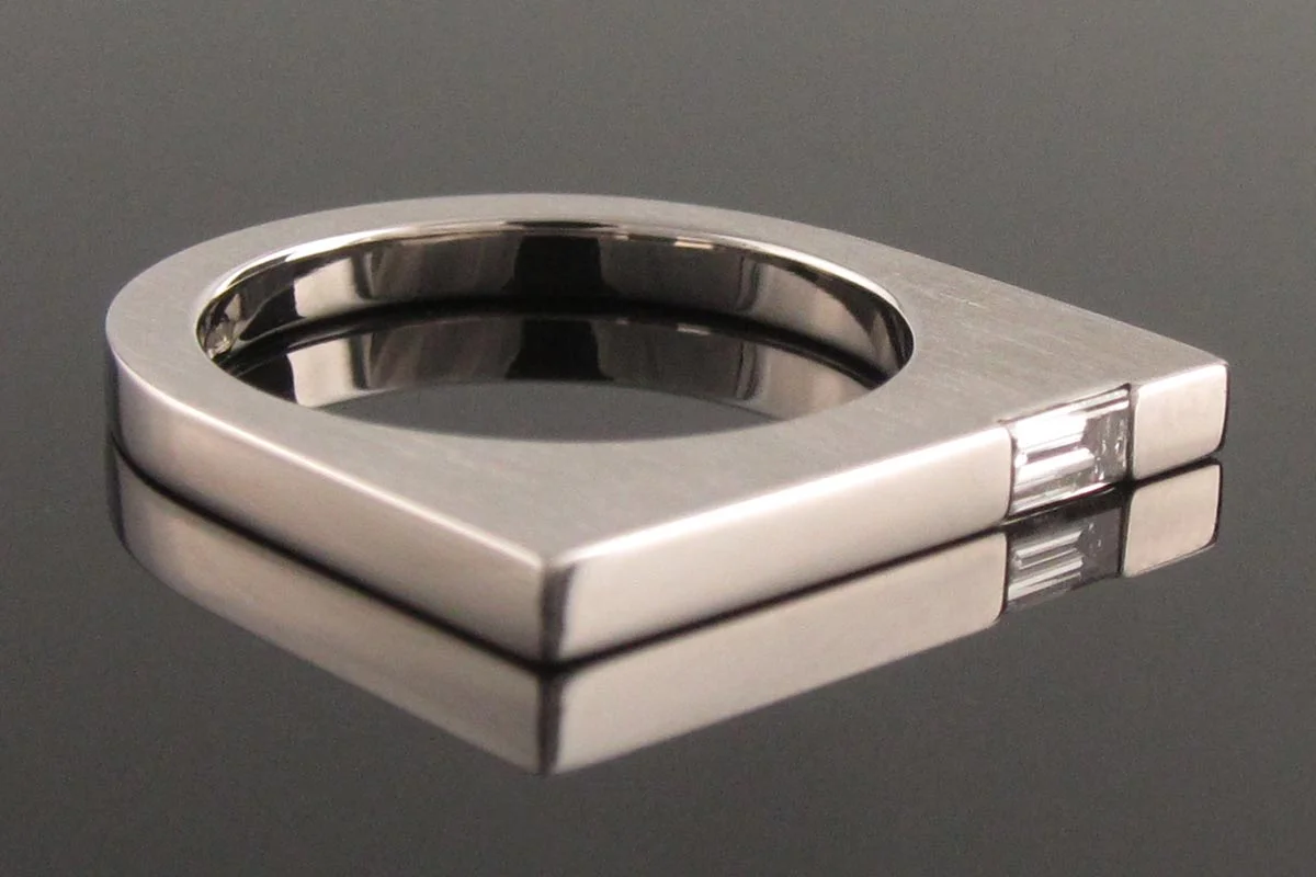Baguette diamond platinum solitaire engagement ring