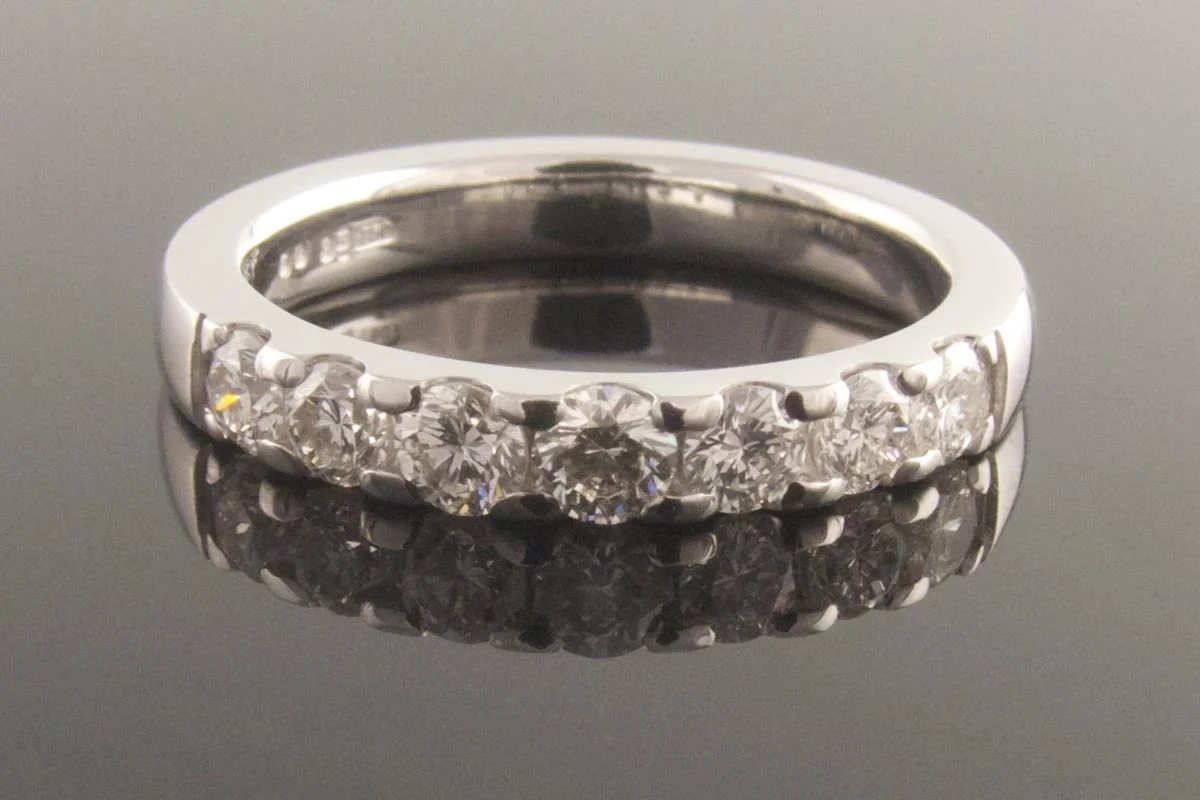 7 stone shared claw diamond ring