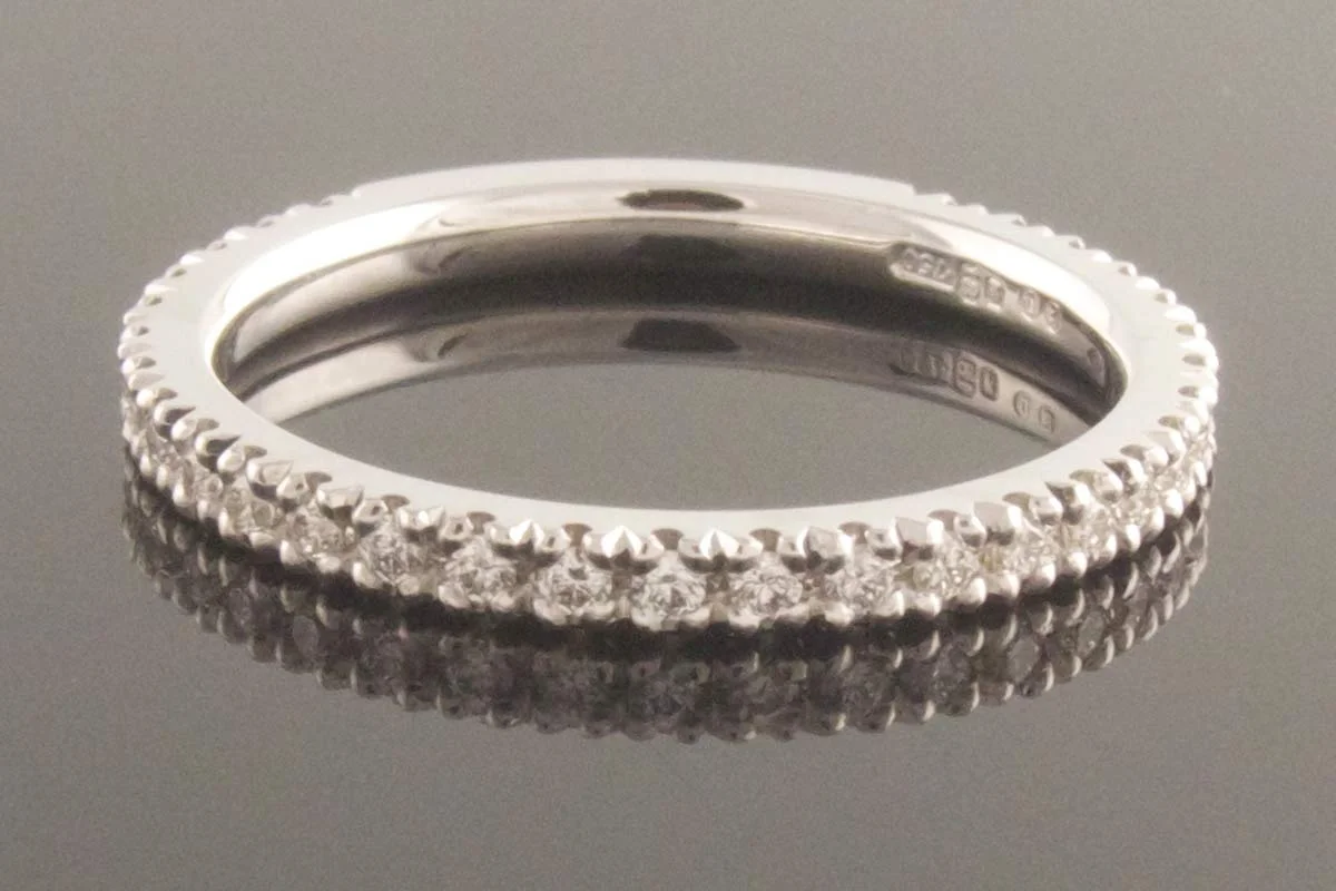 Handmade three quarters diamond eternity ring