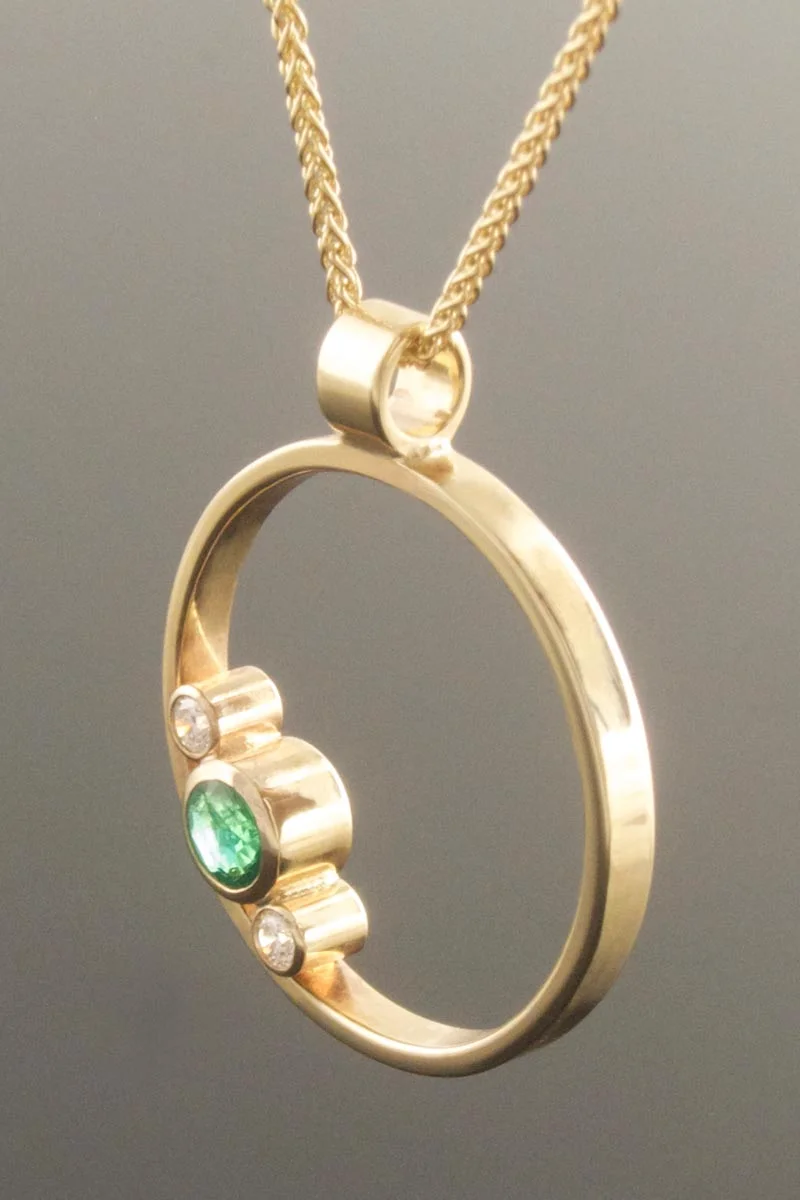 Emerald and diamond circle pendant