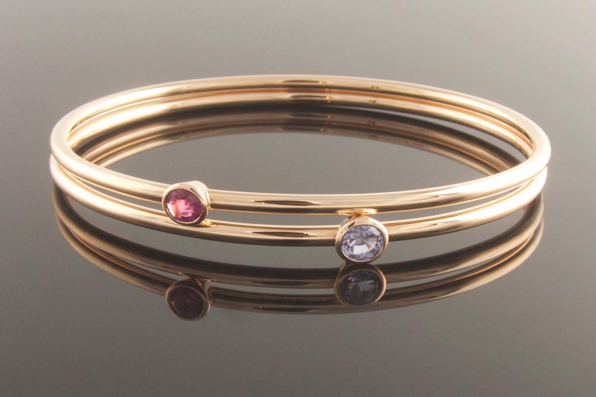 Round wire bangles with ruby and sapphire
