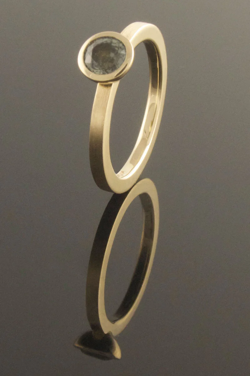 Green sapphire engagement ring