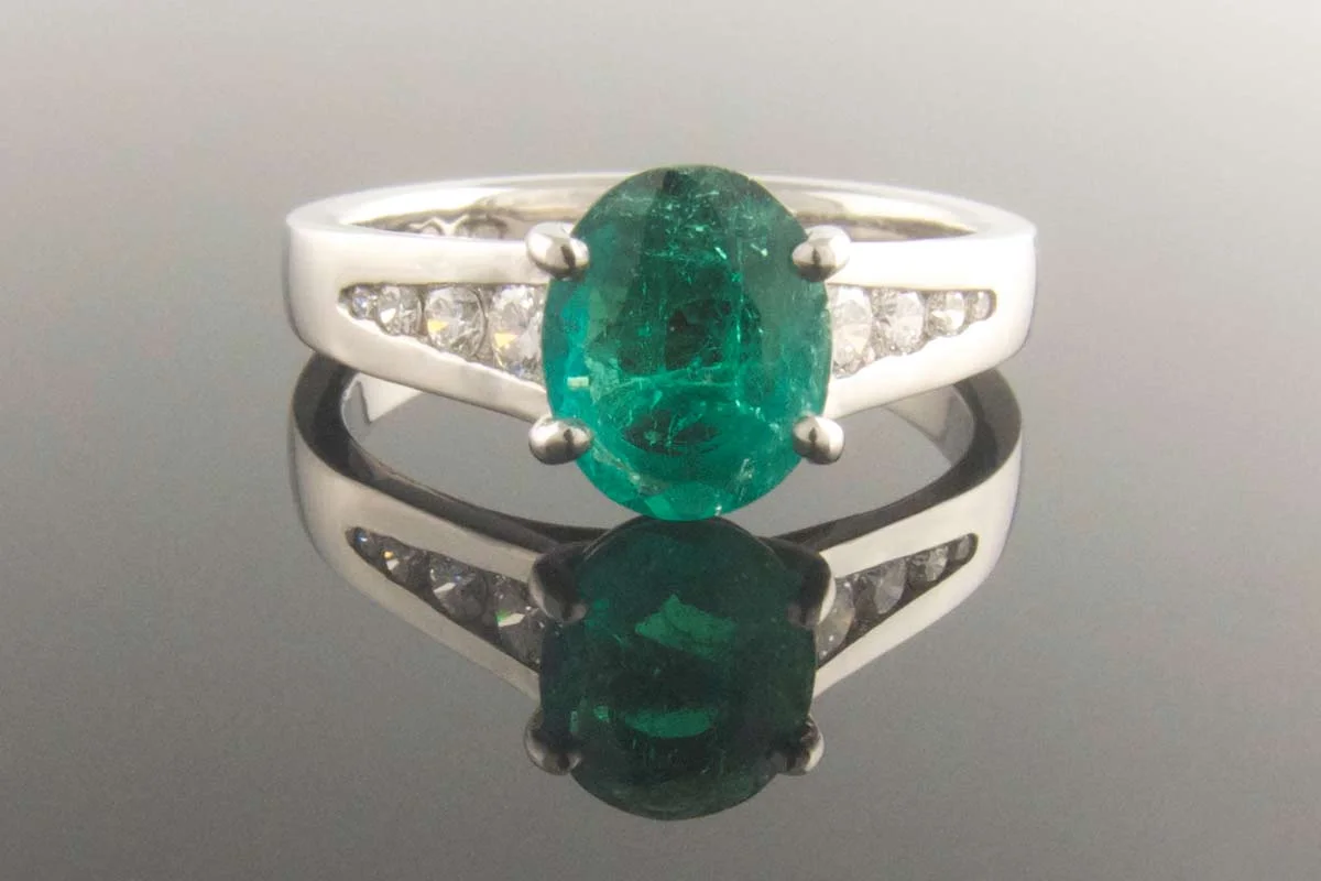 Emerald and diamond engagement ring