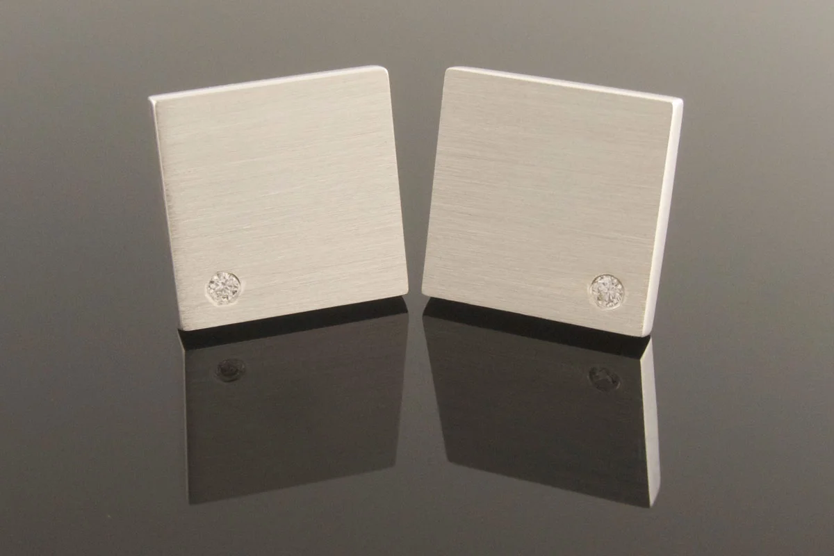 Square silver cufflinks with diamond detail