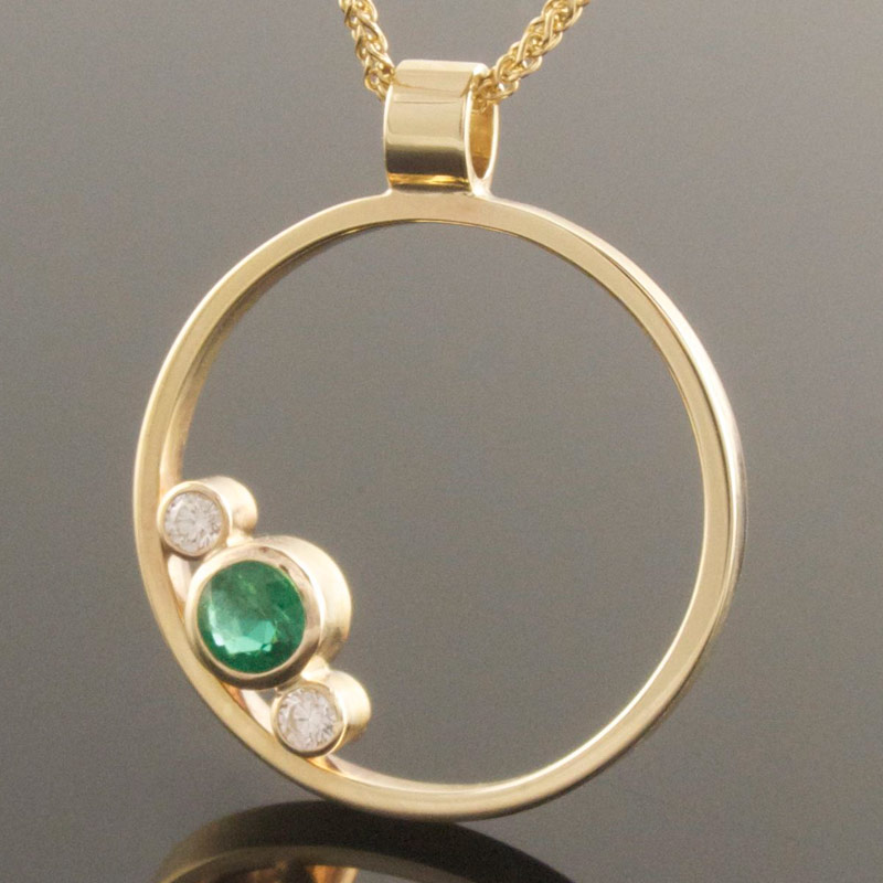 Emerald-and-diamond-circle-pendant.jpg