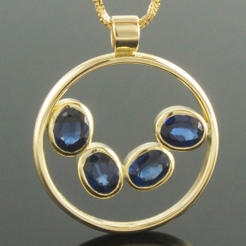 Four-stone-oval-blue-sapphire-circle--pendant.jpg