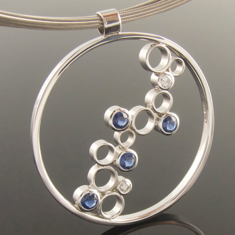 Large-apphire-and-diamond-circle-pendant.jpg