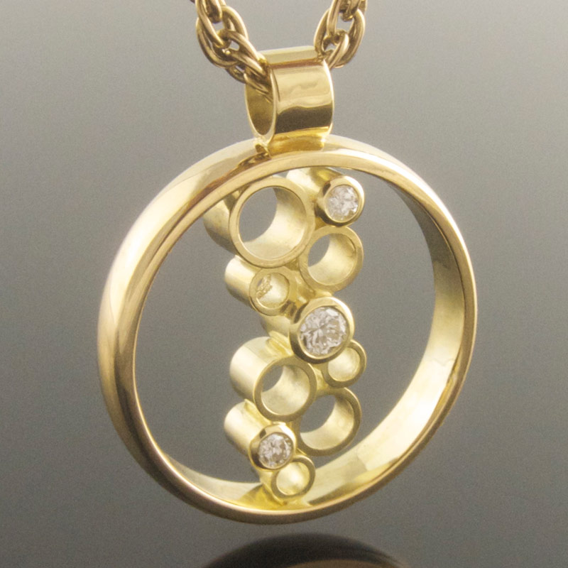 Three-stone-diamond-circle-pendant-with-empties.jpg