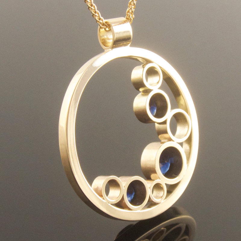 Three-stone-sapphire-circle-pendant-reverse.jpg