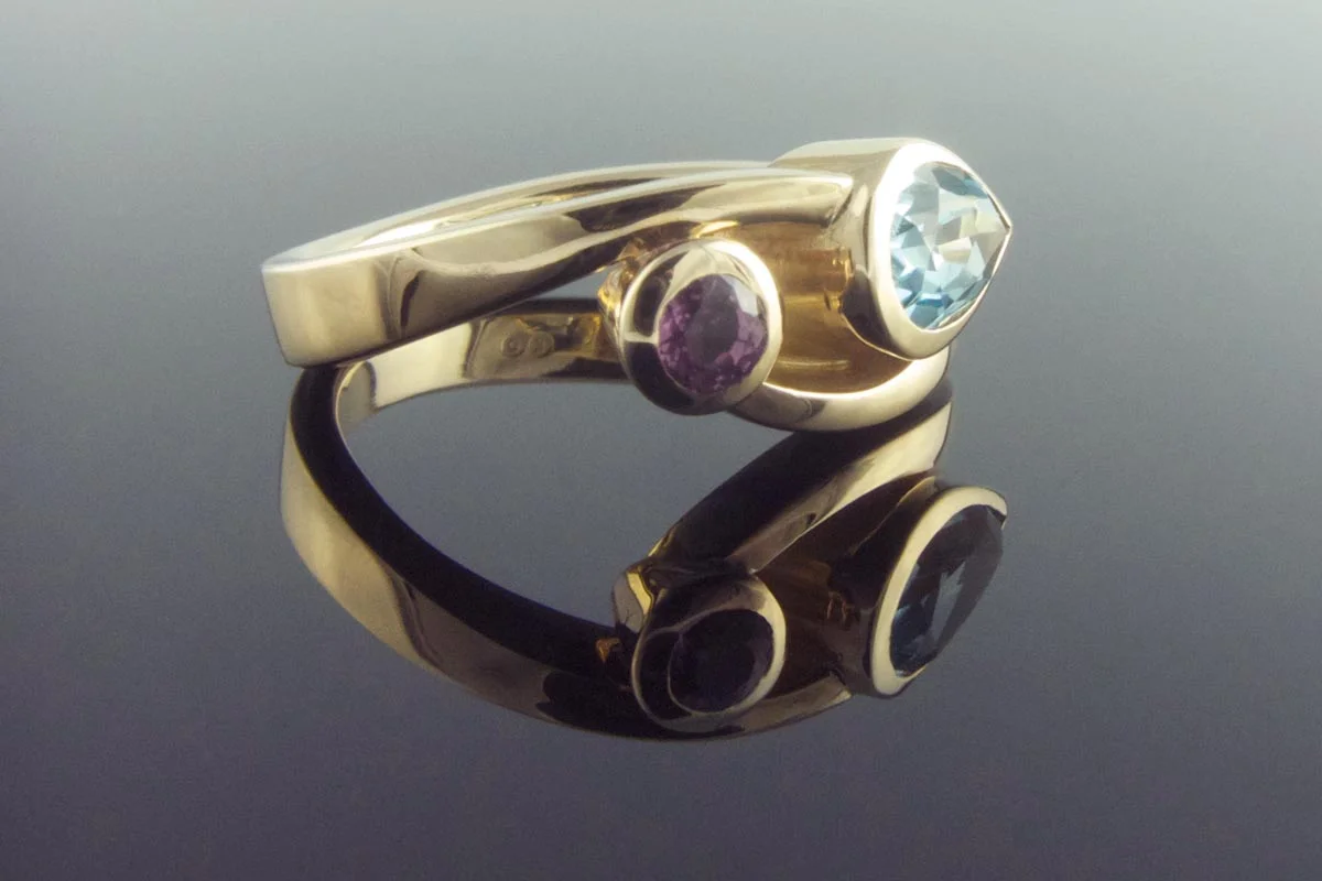 Twisted sapphire and aquamarine ring
