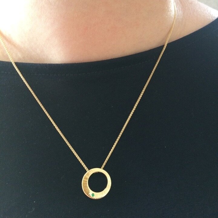 Couldn't resist a second pic of the round gold pendant with a single emerald.