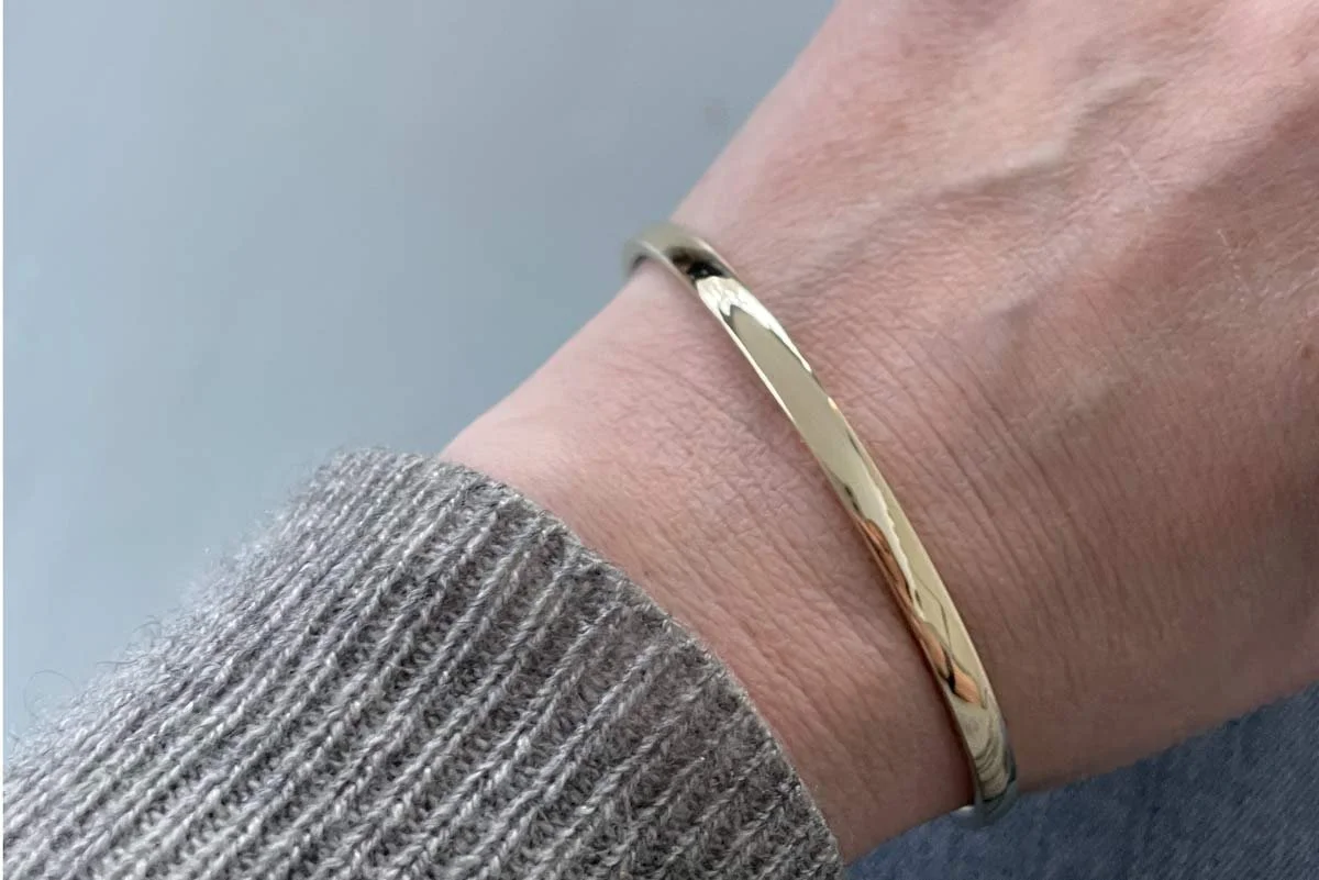 4mm-half-round-gold-bangle-landscape-on-hand-2.jpg