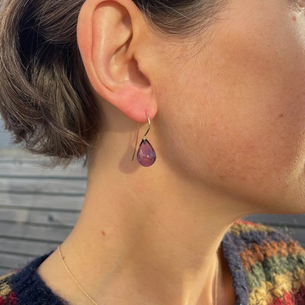 Amethyst drop earrings on a simple 9ct yellow gold hook in wear