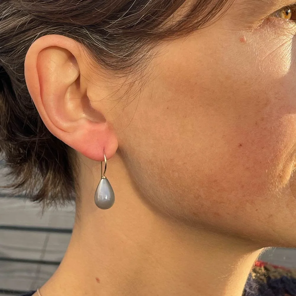 Grey moonstone 14x10mm drop earrings on simple 9ct yellow gold hooks in wear