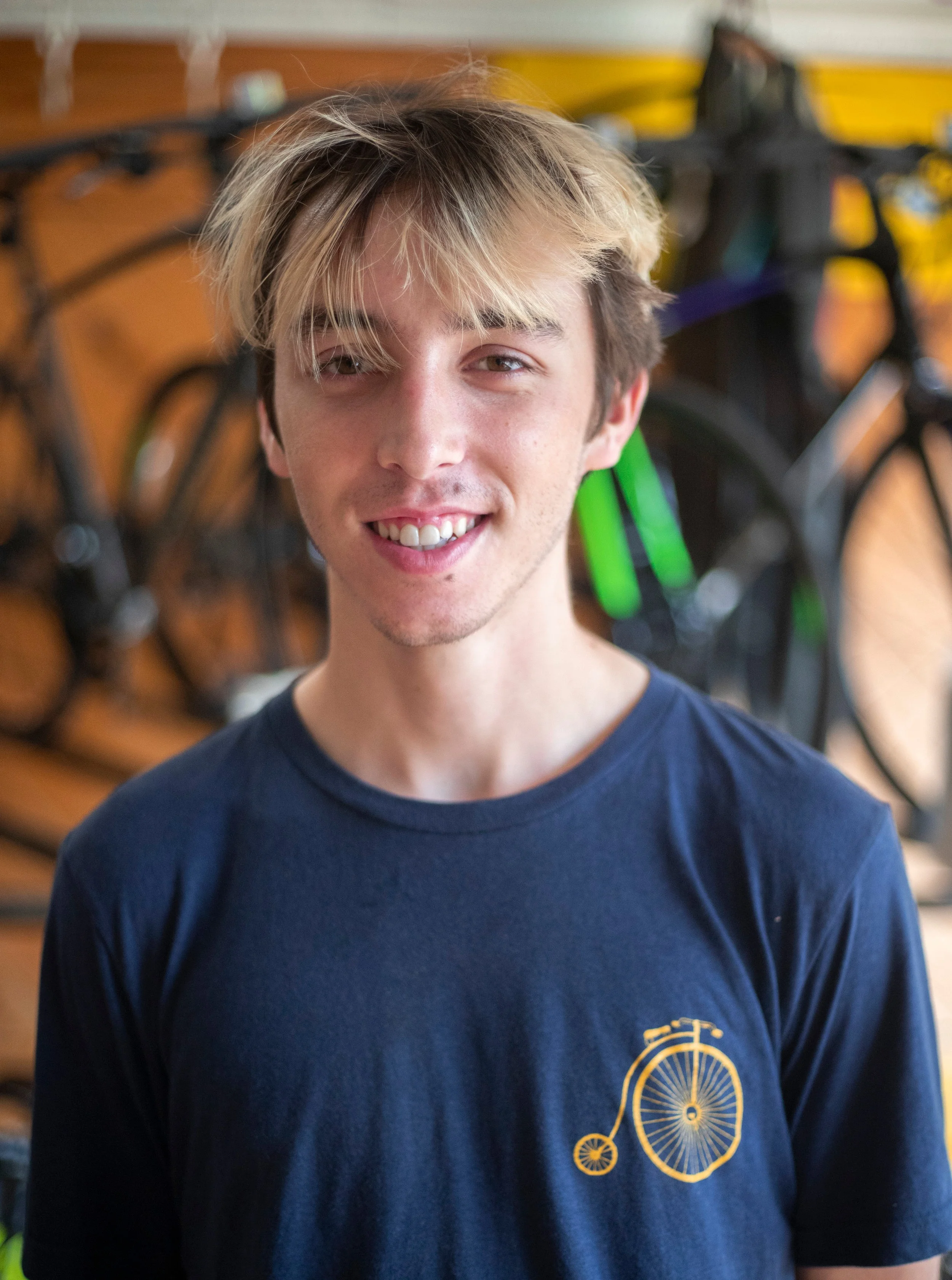 Nate Hometown: Pittsburgh, PA Experience: Has worked at bike shops and has been into racing and riding for four years and has been working here since 2018. Favorite Bike: Cinelli Mash Parallax Fixed Gear What do you do when you are not on the bike? Works on music and reads/writes.