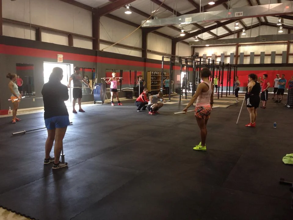 Coach Sheppard teaching a progression on Coach Smith in Petal, Mississippi. Photo credit: Katie Graverson