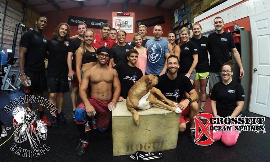 CrossFit Ocean Springs attendees with Coach Smith (far right) and Coach Sheppard (bottom right). Junior lifters Vic Sanders (far left) & Caleb Gressett (second to left) helped coach and demonstrate at this event. Photo credit: Tyler Smith