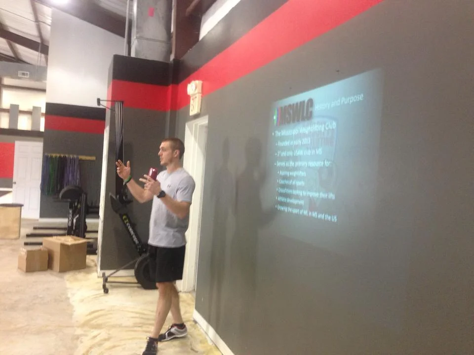 Coach Smith discussing the origin of the sport and the club at a gym in Petal, Mississippi. Photo credit: Amber Sheppard