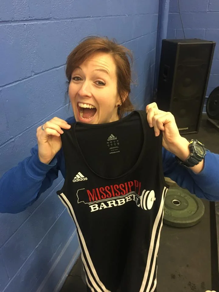 Mississippi Barbell athlete Laura Ostrander with her custom singlet.