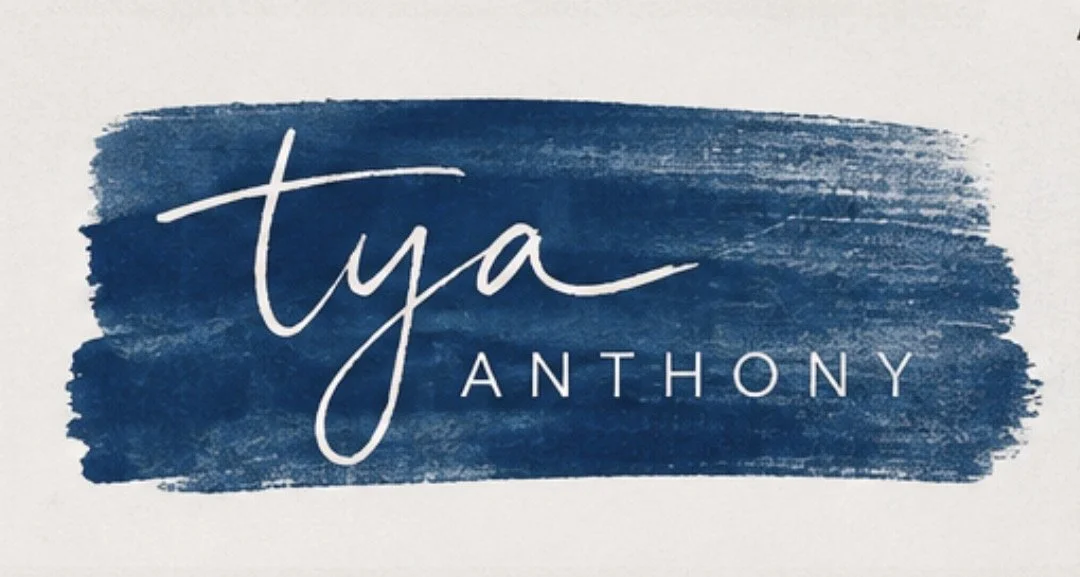 Stylized text of the name 'Tya Anthony' over a blue painted background.