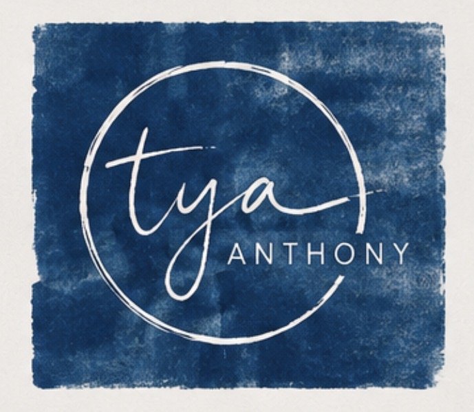 Logo with the handwritten name 'Tya' inside a circle and the last name 'Anthony' below, on a textured blue background.