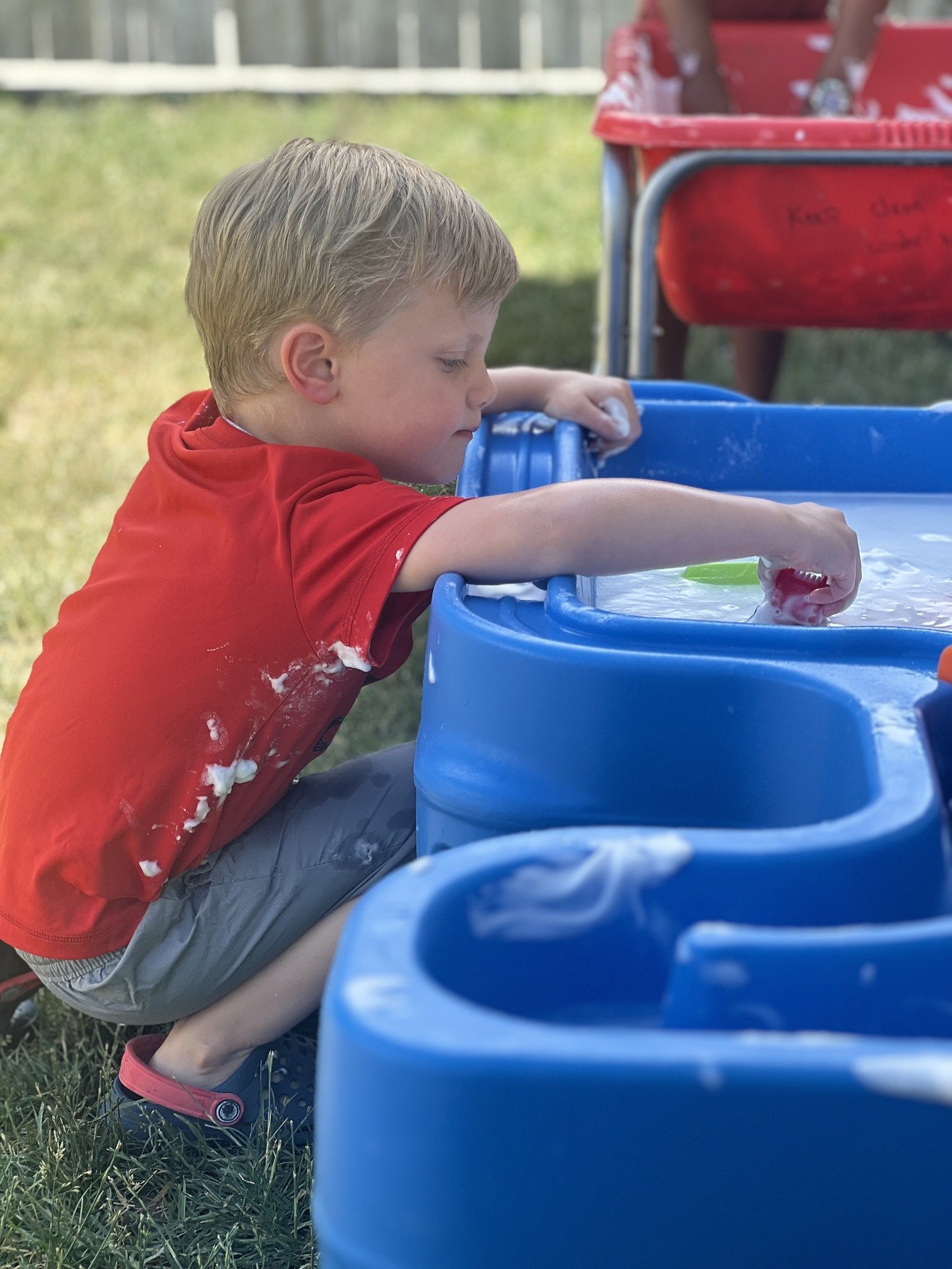 boy and water table.jpeg