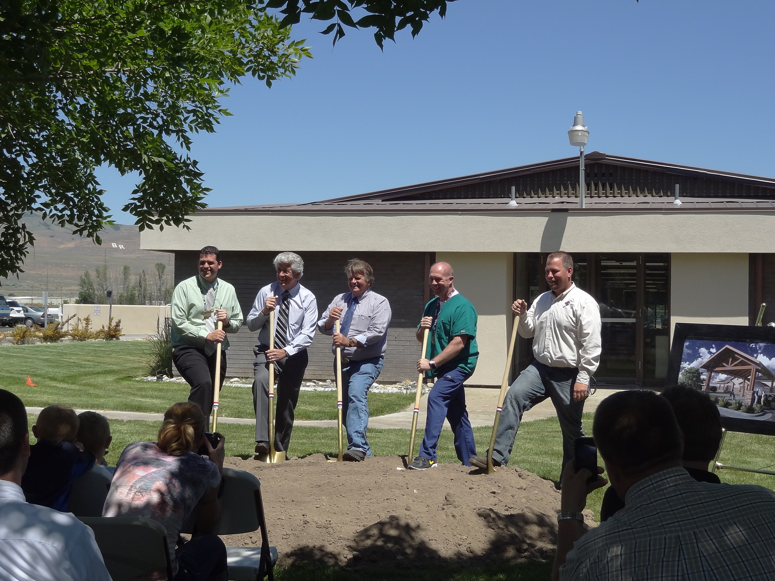 Turning shovels of dirt, from left to right: Brandon Sturdevant, Administrator of Bear River Valley Care Center, Gary Kelso, President and CEO of Mission Health Services, Mayor Roger Fridal, the director of nursing for Bear River Valley Care Center, and Cole Knighton, Project Manager for Spindler Construction