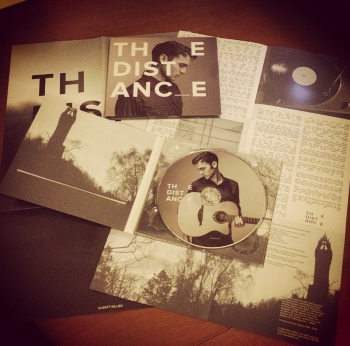 The design Designs for The Distance were inspired by Japanese minimalism and the foggy images of Robert's homeland. I created the limited release EP and the full album, complete with foldout poster and lyrics sheet.
