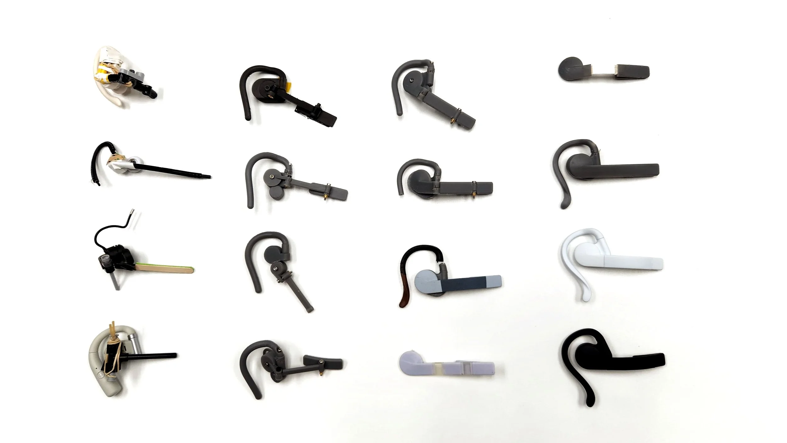 An array of physical Wispr Air prototypes on a table top showing the development in a snapshot.