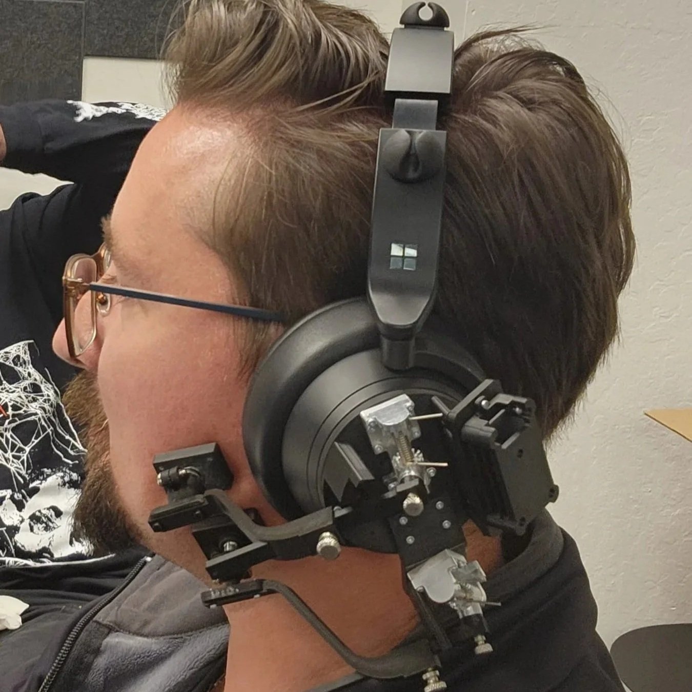 Spanner ID lead David Bogdal fit-testing an early Wispr Pro prototype.