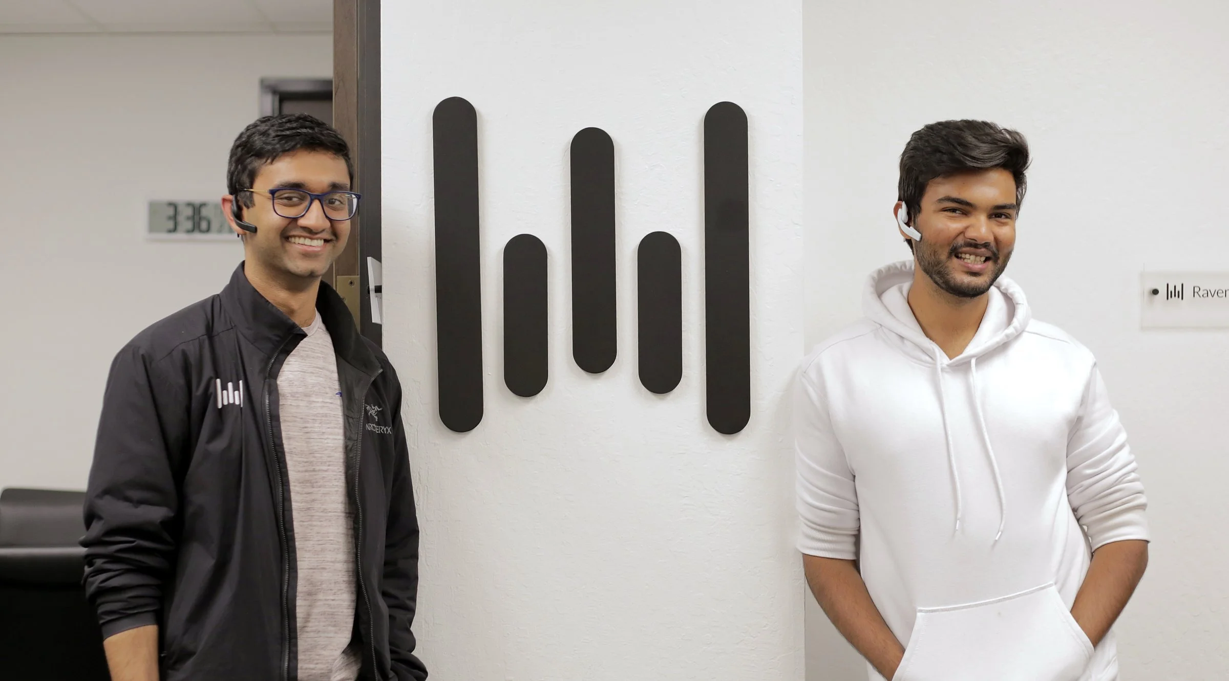 Wispr founders wearing black and white color Wispr Air prototypes