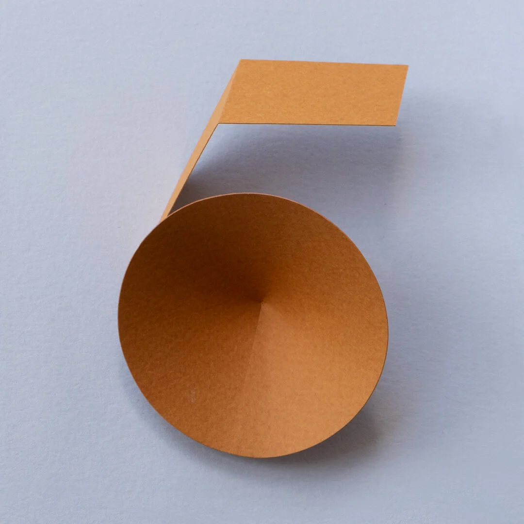 A dark tan paper number 5