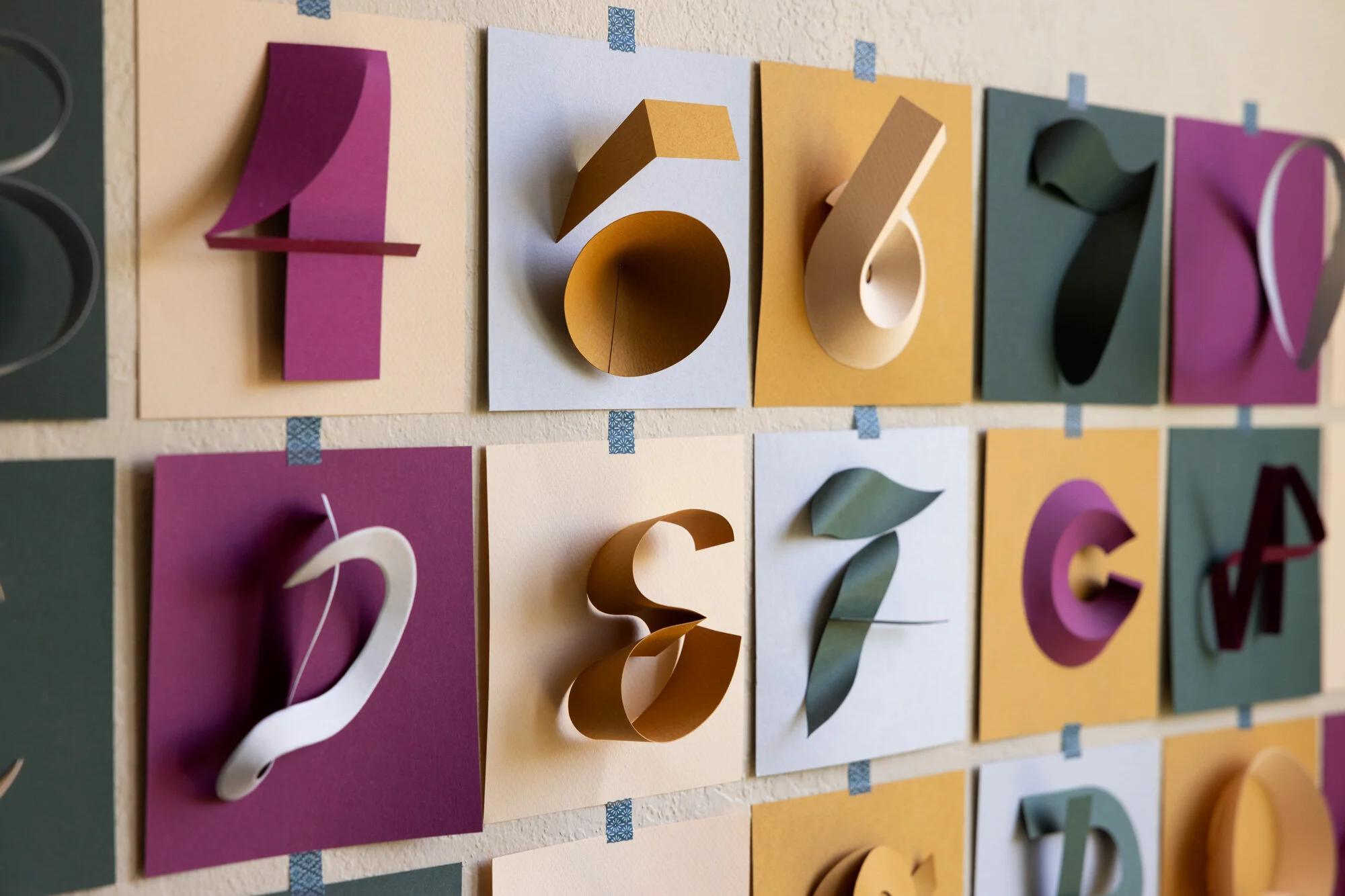 Angled close up shot of a grid of paper letters