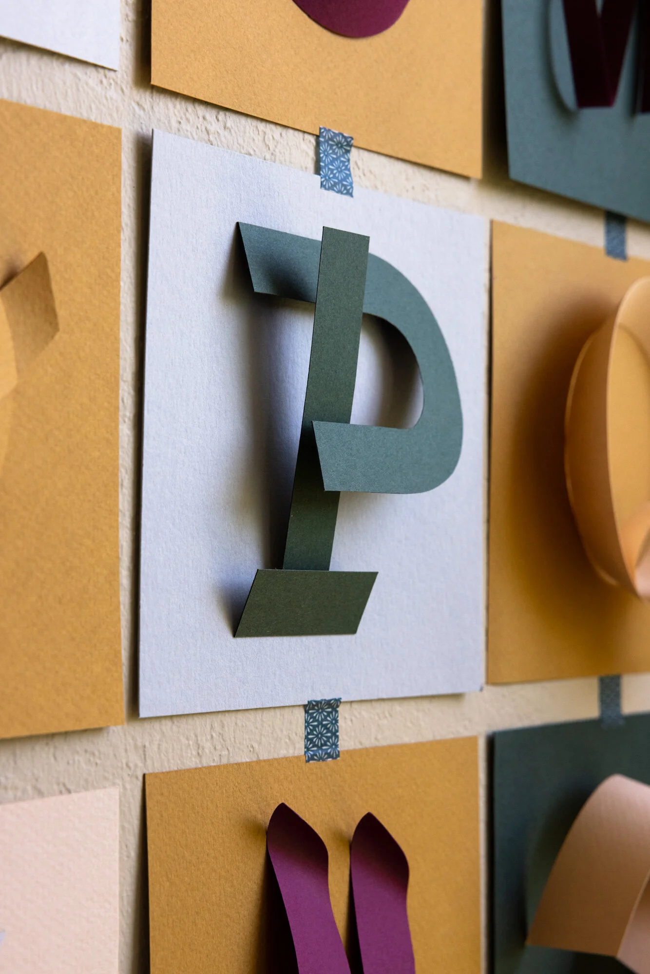 A close up image of a paper letter P