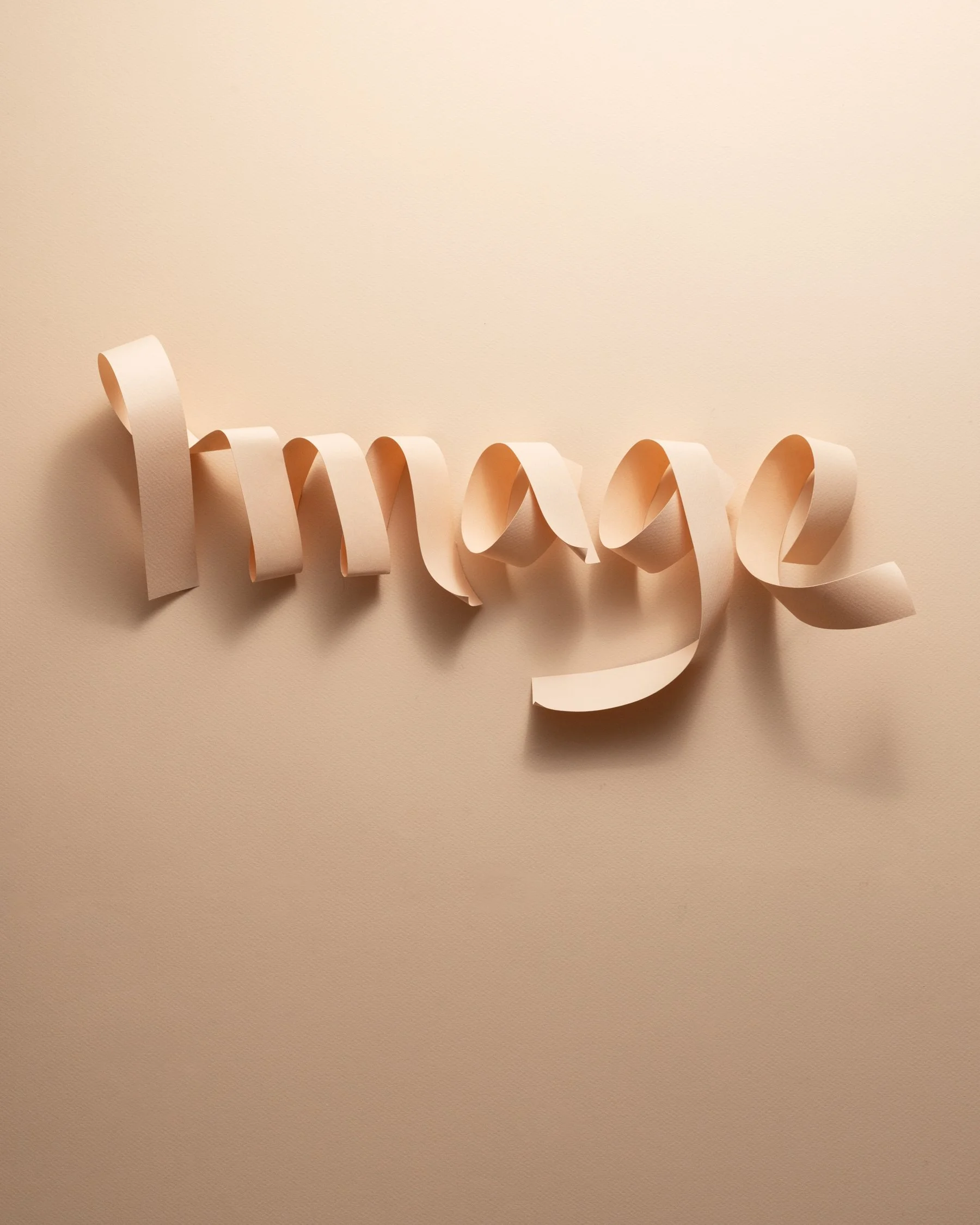 Paper letters spelling the word "image"